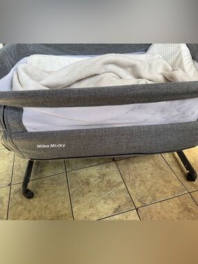 Gray Bassinet with Mesh Sides